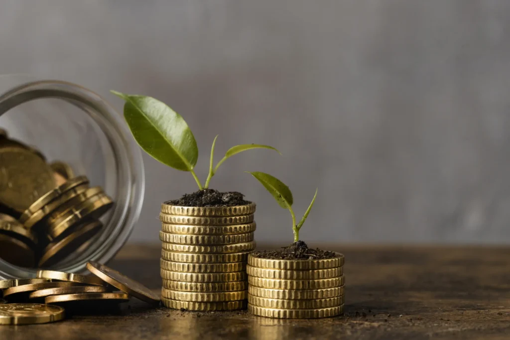 front-view-two-stacks-coins-with-jar-plants-scaled