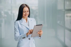 young-business-woman-isoled-holding-tablet-scaled